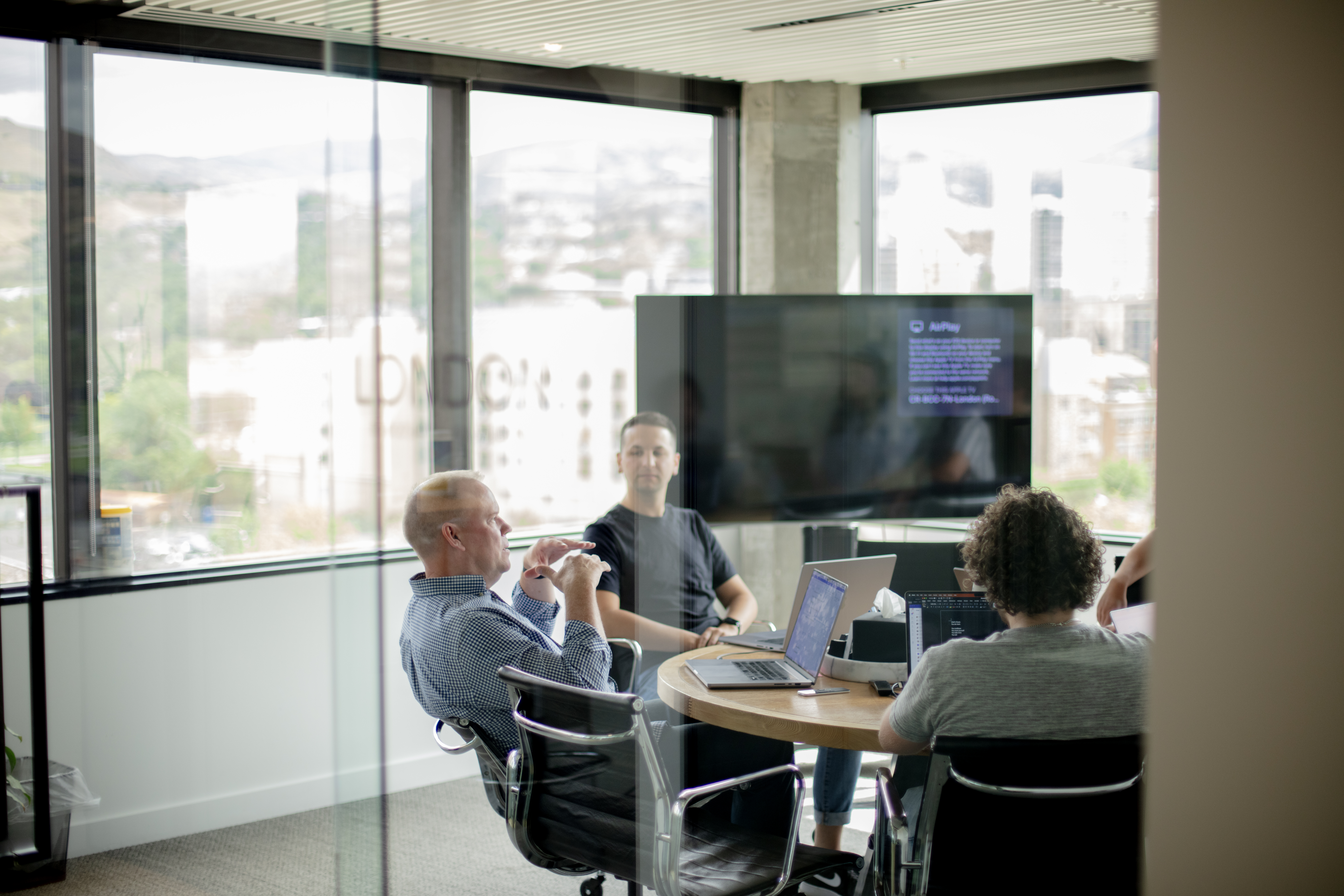 A team meeting in an airy conference room.