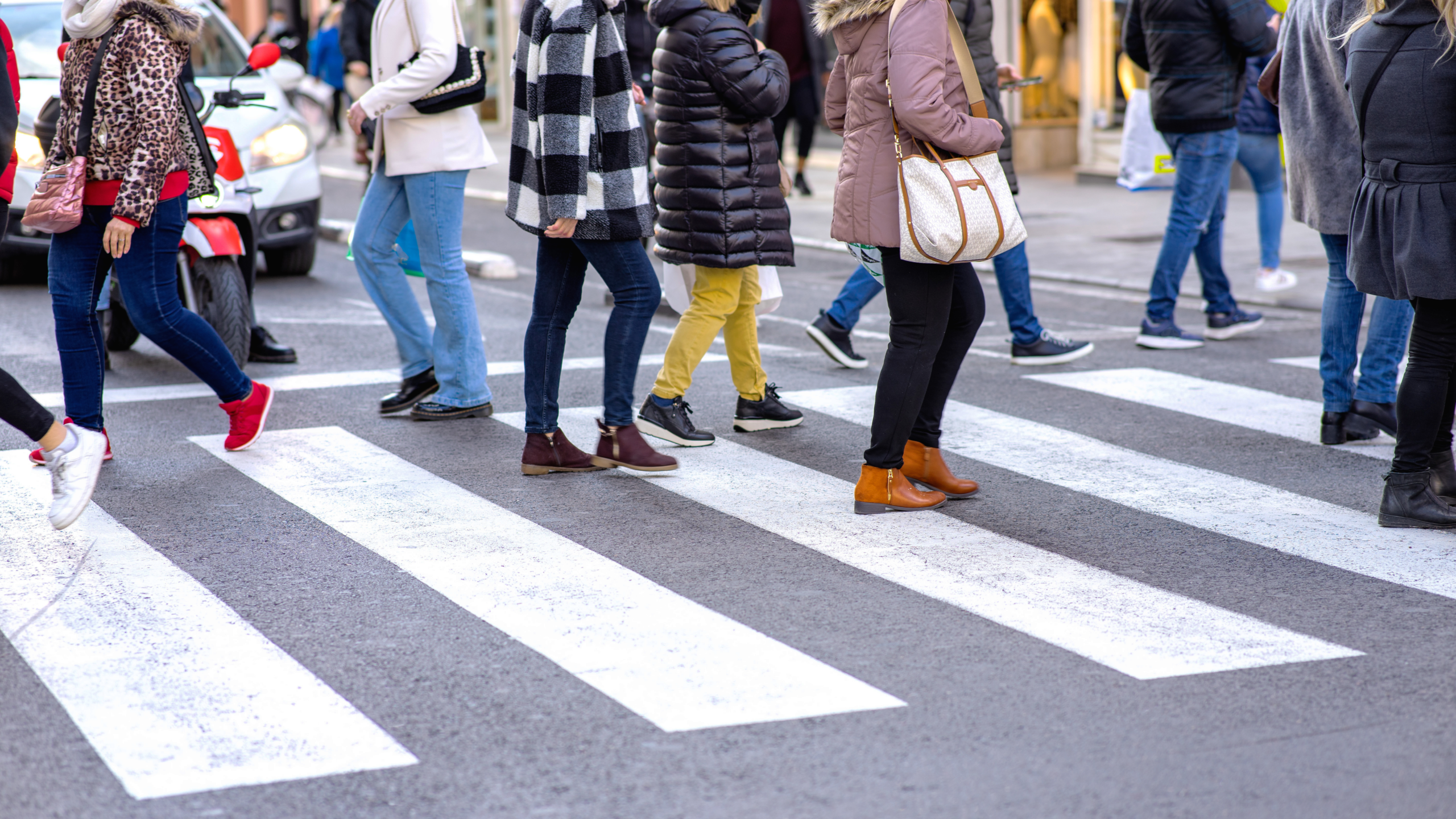 a close up of a busy crosswalk