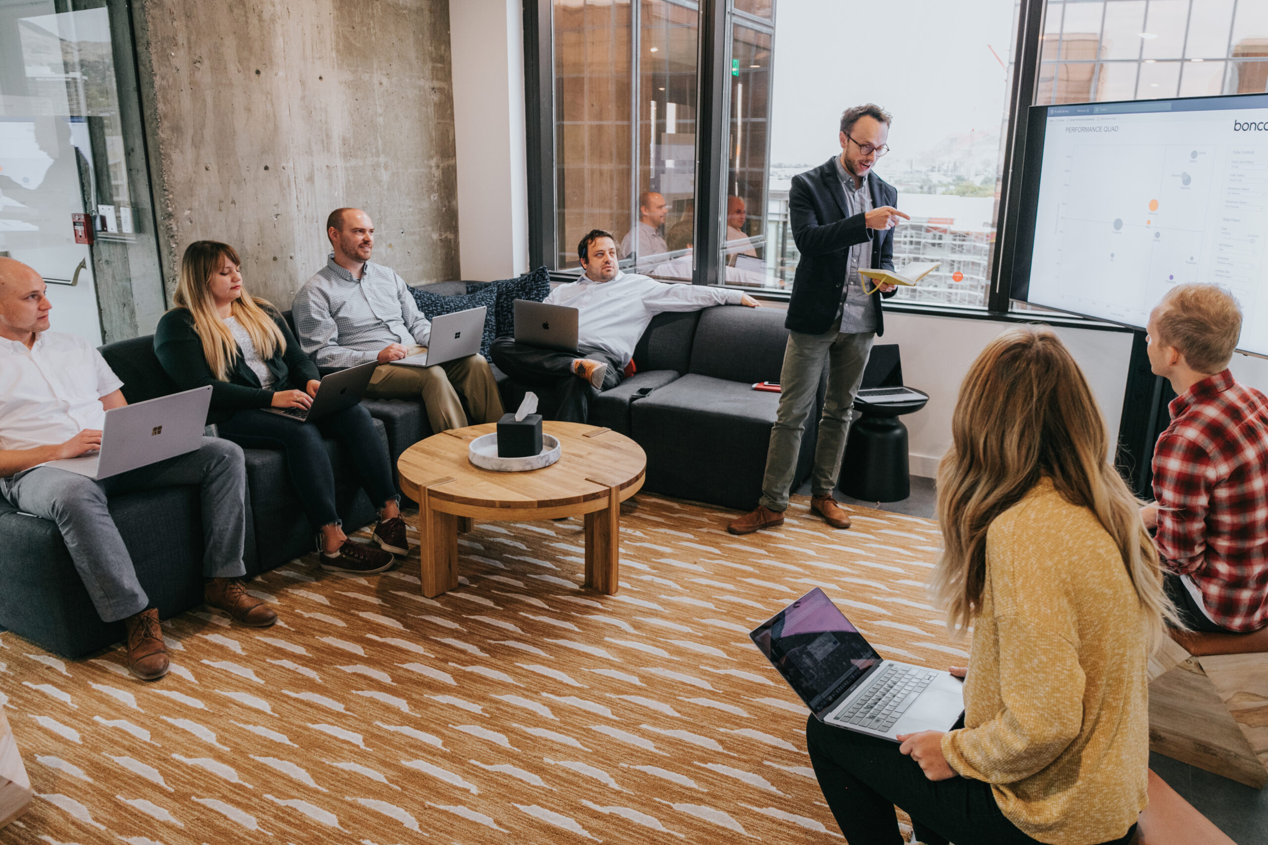 The Boncom team discussing a project in a work room.